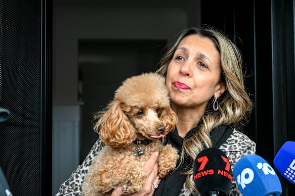 Neighbor Caterina Fazzolarro and her dog Oscar.