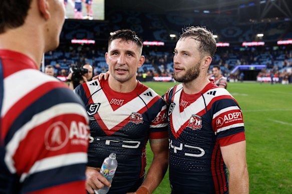 Victor Radley celebrates the win over the Broncos with Sam Walker.