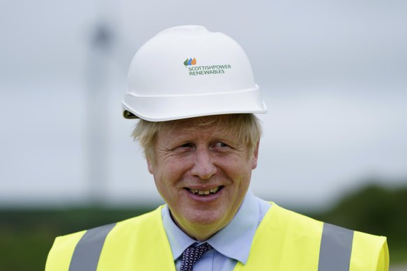 British Prime Minister Boris Johnson, seen here at a wind farm in Cornwall on Wednesday, will push Australia on climate change action. 