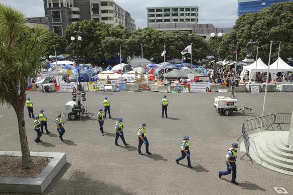 Police during a protest outside Parliament in Wellington, New Zealand. 