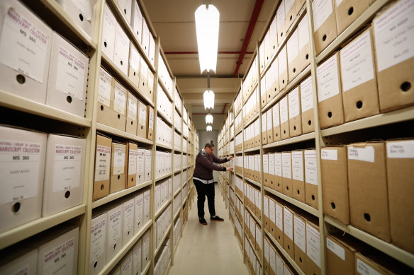 An educator, Yanti Ropeyarn, amid the shelves of the National Library of Australia, in 2017.