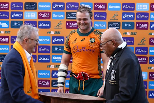 Australia and Fiji’s prime ministers, Anthony Albanese and Sitiveni Rabuka, present Harry Wilson the Vuvale Bowl after Australia’s close victory last week.