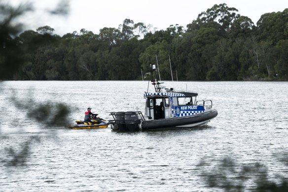 Police search the water for two missing children.