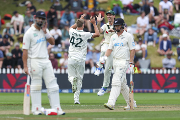 Cameron Green celebrates with Mitchell Marsh after taking the wicket of Scott Kuggeleijn.