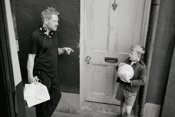 Director Kenneth Branagh, left,  with actor Jude Hill on the set of Belfast. 