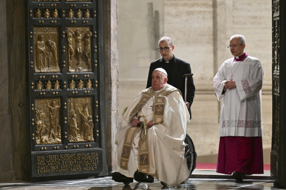 Pope Francis opens the Holy Door of St Peter’s Basilica to mark the start of the Catholic Jubilee Year on Christmas Eve 2024.