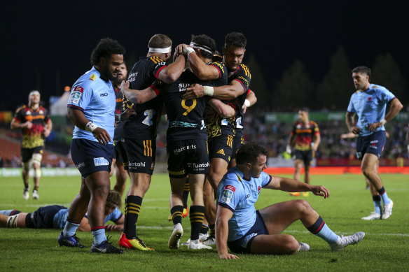 The Chiefs celebrate a try against the Waratahs on Saturday.