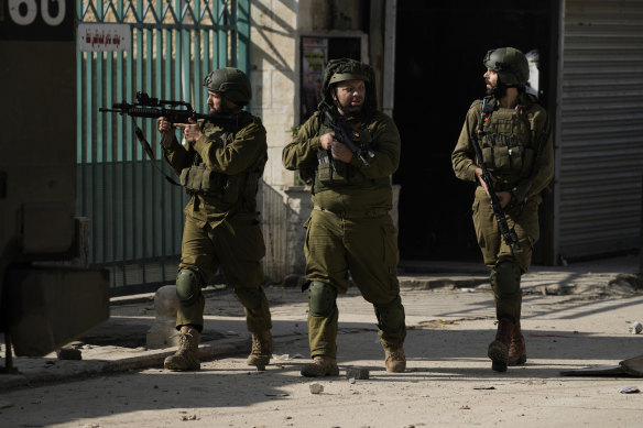 Israeli soldiers are seen during an army operation, in the Jenin refugee camp, West Bank.