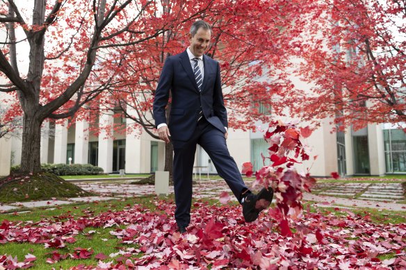 Treasurer Jim Chalmers takes a light-hearted moment before he hands down the budget.