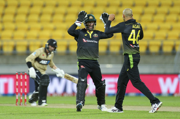Ashton Agar celebrates one of his six wickets with Matthew Wade.