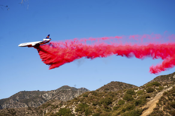 An air tanker drops fire retardant in Altadena.