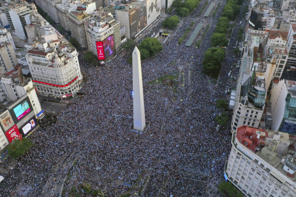 Argentina fans celebrates on Buenos Aires’ famed Avenida 9 de Julio.