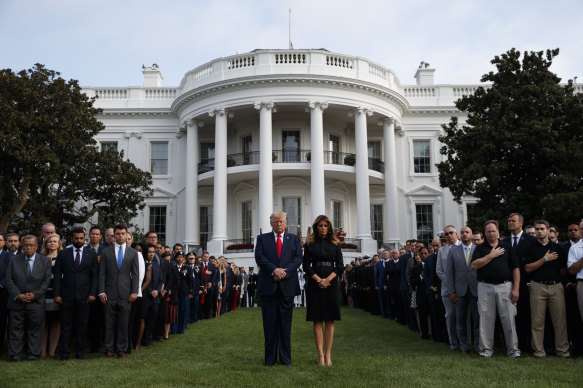 President Donald Trump and Melania Trump participate in a moment of silence honouring the victims of the September 11 terrorist attacks.