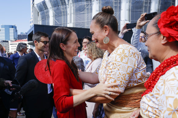 Jacinda Ardern hugs incoming Deputy Prime Minister Carmel Sepuloni as she leaves parliament in New Zealand for the last time as prime minister on Wednesday morning.