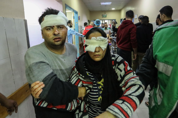 Palestinians injured in Israeli airstrikes arrive at Nasser Medical Hospital in Khan Younis, Gaza. 