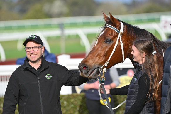 Trainer Luke Oliver poses after Justdoit won at Sandown Lakeside Racecourse in July 2024.