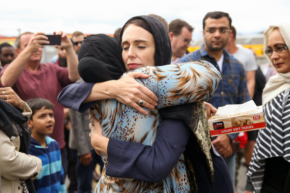 Jacinda Ardern hugs a woman at a mosque in Wellington, two days after the Christchurch mosque shootings.