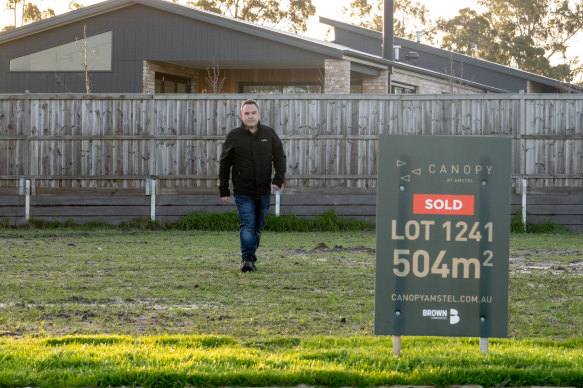 Tristan McSwain, who has been excluded from government support for Porter Davis customers, at his empty block in Cranbourne.