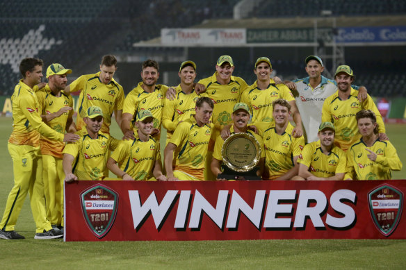 Australian players pose for a photo with the trophy after winning the Twenty20 cricket match against Pakistan.