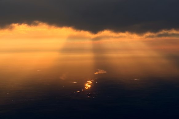 The sun sets through wildfire smoke over Edmonton, Alberta on July 17.