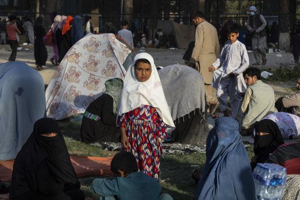 Displaced families wait in a makeshift camp in Share-e-Naw park in Kabul.  