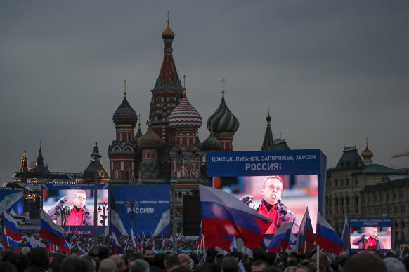 Darkness falls: Big screens with words reading “Donetsk, Luhansk, Zaporizhzhia, Kherson, Russia” and “With Russia forever!”