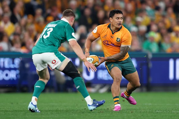 Len Ikitau passing against Ireland in July.