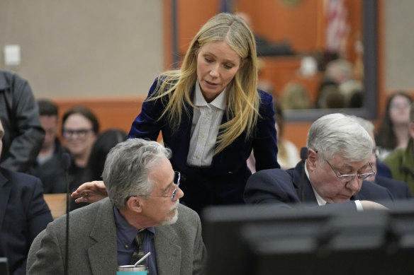 “I wish you well”: Gwyneth Paltrow touches retired optometrist Terry Sanderson, left, as she walks out of the courtroom.