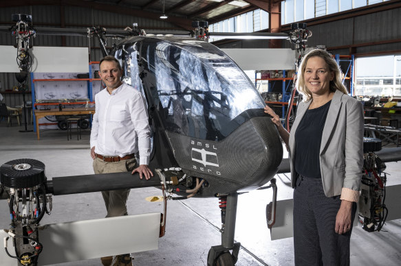 Siobhan Lyndon
and Andrew Moore from AMSL Aero with the Vertiia  aircraft they have designed and are now testing.