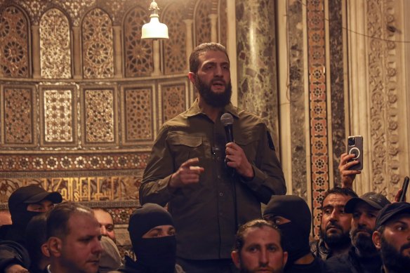 Abu Mohammad al-Golani, Syria’s new de facto leader, speaks at the Umayyad Mosque in Damascus on Sunday.