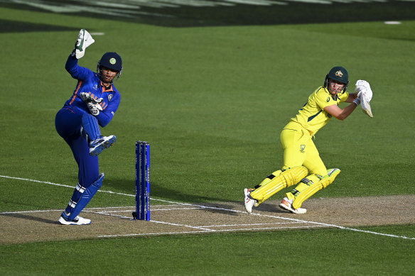 Alyssa Healy guides one away during Australia’s record run-chase against India.
