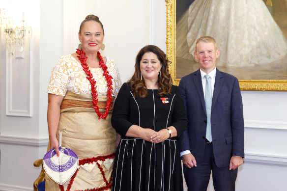 NZ Prime Minister Chris Hipkins, right, Deputy Carmel Sepuloni, left, and Governor-General Dame Cindy Kiro pose during the swearing-in ceremony at Government House in Wellington.