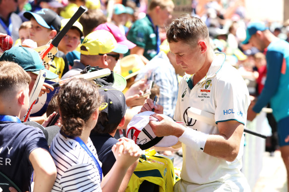 Marnus Labuschagne signs autographs in Adelaide after Australia’s Test win over the West Indies.