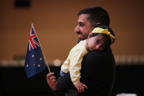 Vikas Gadoo, with one-year-old daughter Tiana, became an Australian citizen at Melbourne Town Hall on Thursday.