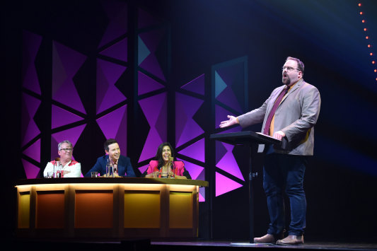 Greg Larsen holds court at Melbourne Comedy Festival’s Great Debate, while Anthony Morgan, Nath Valvo and Jan Fran look on.