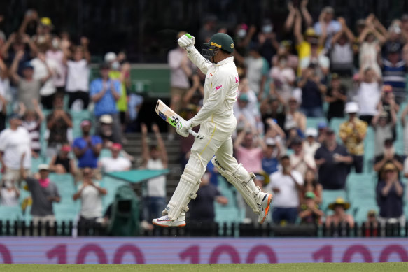 Khawaja leaps for joy after bringing up his century. 