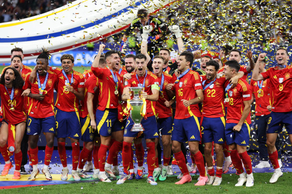 Spain lifts the trophy.