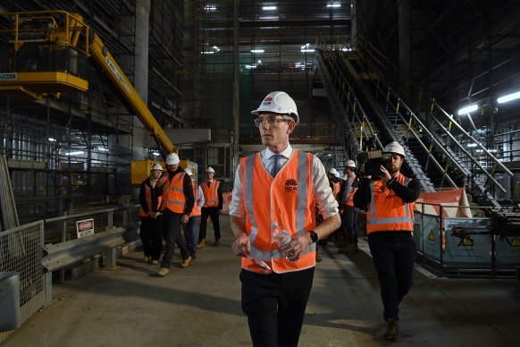 NSW Premier Dominic Perrottet walks through a Metro tunnel beneath Martin Place on Wednesday.