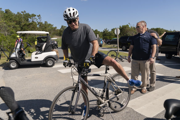 Joe Biden gets back on his bike after falling.