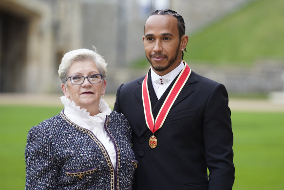 Sir Lewis Hamilton with his mother Carmen Lockhart (nee Larbalestier) after he was made a Knight Bachelor by the Prince of Wales during an investiture ceremony at Windsor Castle in 2021.