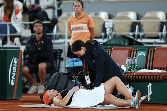 Diana Shnaider receives medical attention during the semi-final.