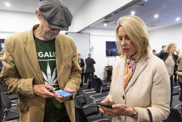 Balance of power: Legalise Cannabis Victoria’s David Ettershank swaps mobile numbers with the Liberal Party’s Georgie Crozier at the announcement of Upper House MPs on Wednesday.
