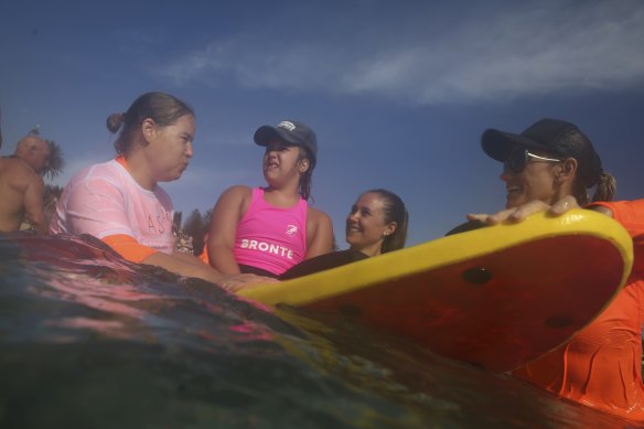 Sophie Snow (aged 8) in the water with mum Sally (behind).
