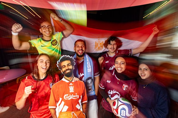 Go Pharaohs: (left to right) University of Melbourne Egyptian Club members Amira Marwan with a cardboard cut-out of player Mo Salah, Essam Altayyar, Mohamed Orabi, Ryan Rud, Mariam El Meligi and Lujain Aldawood.