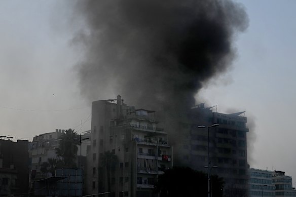 An Israeli airstrike hits a residential and business building in Beirut.