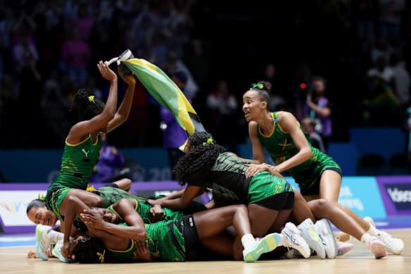 Jamaica celebrates their win over the Diamonds including Shamera Sterling Humphrey, back right.