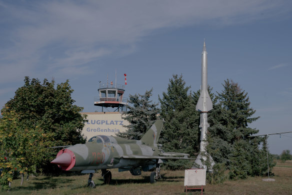 A fighter jet and a missile on display at the airfield in Grossenhain, Germany.