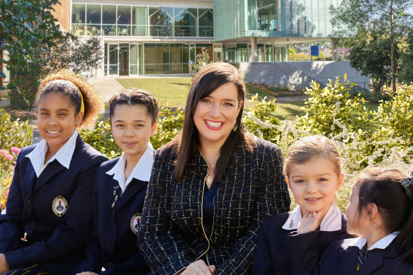 Ravenswood’s Principal Anne Johnstone with Junior and Senior School students.