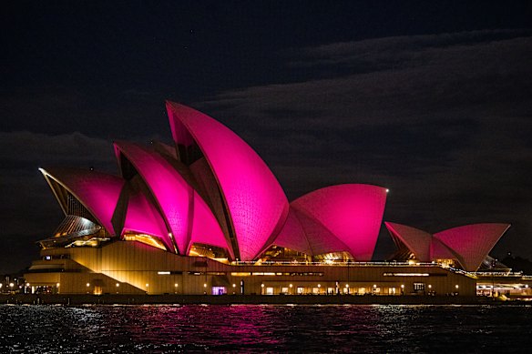 The sails of the Sydney Opera House lit pink in honour of the life of Dame Olivia Newton-John.