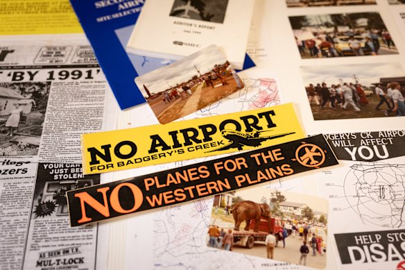 Photos, newspaper clippings and stickers against the airport from the early 1980s.